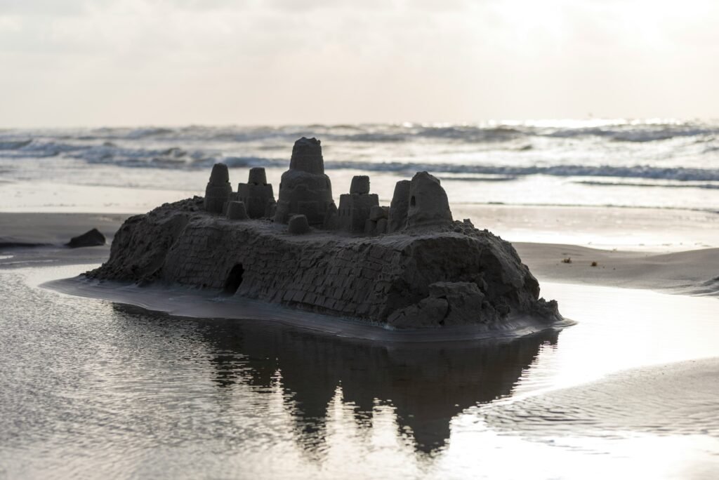 Until June comes again, sandcastles like the one shown will disappear with the waves.