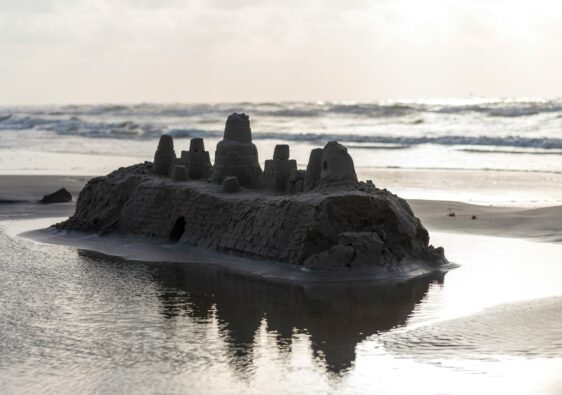 Until June comes again, sandcastles like the one shown will disappear with the waves.